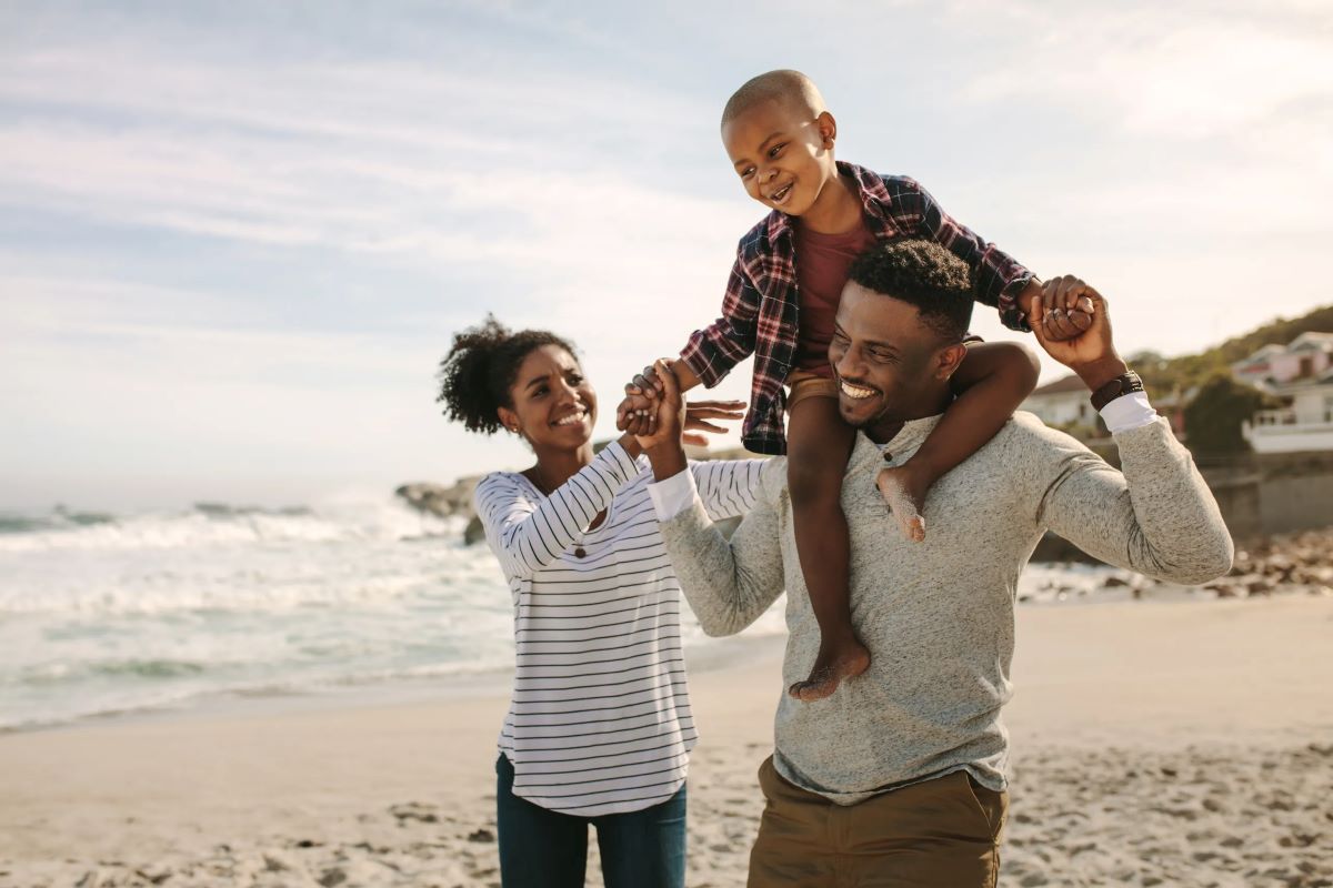 Happy family outside on the beach